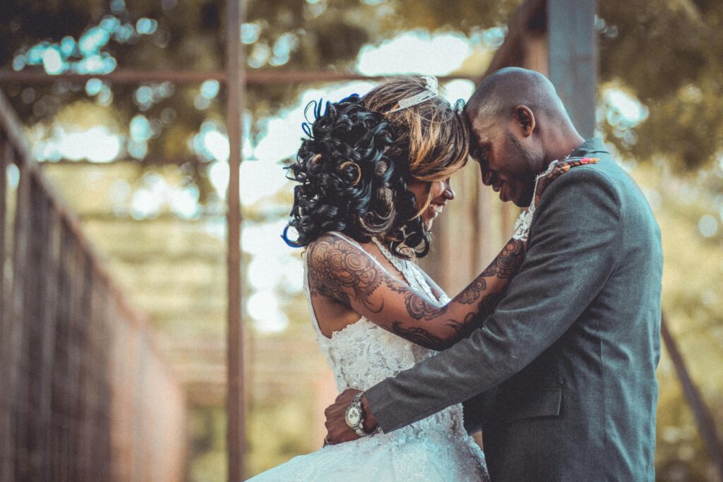 A joyful couple embracing on their wedding day, showcasing love and commitment.